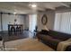 Living room with tiled floors and a view of the dining area at 1707 E Mclellan Blvd, Phoenix, AZ 85016