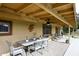 Patio dining area with ceiling fan and view of pool at 1707 E Mclellan Blvd, Phoenix, AZ 85016