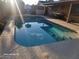 Relaxing pool area with a covered patio and outdoor dining set at 1707 E Mclellan Blvd, Phoenix, AZ 85016