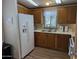 Cozy kitchen featuring wood cabinets and modern appliances at 17200 W Bell Rd # 1599, Surprise, AZ 85374