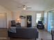 Living room with hardwood floors, comfortable seating, and built-in shelving at 17200 W Bell Rd # 1599, Surprise, AZ 85374