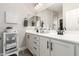 Double vanity bathroom with modern finishes and a large mirror at 17502 W Blue Sky Dr, Surprise, AZ 85387