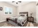 Bright bedroom with a ceiling fan and wood-look floors at 17502 W Blue Sky Dr, Surprise, AZ 85387