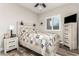 Charming bedroom with a wood-look floor and a ceiling fan at 17502 W Blue Sky Dr, Surprise, AZ 85387