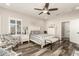 Spacious bedroom with wood-look floors and a ceiling fan at 17502 W Blue Sky Dr, Surprise, AZ 85387