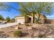 Charming house with a two-car garage and gravel landscaping at 17502 W Blue Sky Dr, Surprise, AZ 85387