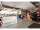 Garage with an open door, showing views of the neighborhood at 17502 W Blue Sky Dr, Surprise, AZ 85387