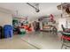 Garage with storage shelving and space for two cars at 17502 W Blue Sky Dr, Surprise, AZ 85387