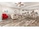 Open concept living room with a view into the kitchen and dining area at 17502 W Blue Sky Dr, Surprise, AZ 85387