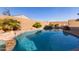 Large, refreshing pool with rock accents at 17502 W Blue Sky Dr, Surprise, AZ 85387