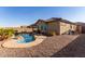 Stunning pool and spa with rock waterfall feature at 17502 W Blue Sky Dr, Surprise, AZ 85387