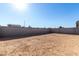 Empty lot with block wall and sandy ground at 17645 W Jackson St, Goodyear, AZ 85338