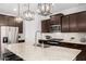 Modern kitchen with stainless steel appliances and granite countertops at 17645 W Jackson St, Goodyear, AZ 85338