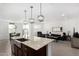 Modern kitchen with island, stainless steel appliances, and open concept at 17645 W Jackson St, Goodyear, AZ 85338