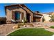 Landscaped front yard with attractive curb appeal and a two-car garage at 1820 N Bernard --, Mesa, AZ 85207