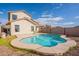 Two-story house with a kidney-shaped pool and backyard at 18204 N 11Th Dr, Phoenix, AZ 85023