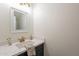 Modern bathroom with white vanity and gold fixtures at 18204 N 11Th Dr, Phoenix, AZ 85023