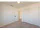 Spacious bedroom with double door closet and carpet flooring at 18204 N 11Th Dr, Phoenix, AZ 85023