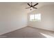 Spacious bedroom with ceiling fan and carpet at 18204 N 11Th Dr, Phoenix, AZ 85023