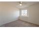 Bright bedroom with ceiling fan and carpet flooring at 18204 N 11Th Dr, Phoenix, AZ 85023