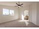 Bright bedroom with ceiling fan and en-suite bathroom at 18204 N 11Th Dr, Phoenix, AZ 85023