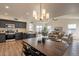 Bright dining area with rustic wood table and modern chairs at 18204 N 11Th Dr, Phoenix, AZ 85023