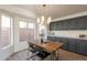 Kitchen dining area with farmhouse table and chandelier at 18204 N 11Th Dr, Phoenix, AZ 85023