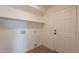 Laundry room with built-in shelving and door at 18204 N 11Th Dr, Phoenix, AZ 85023