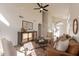 Living room with vaulted ceiling, leather sofa and two armchairs at 18204 N 11Th Dr, Phoenix, AZ 85023