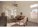 Living room with vaulted ceiling, leather sofa and two armchairs at 18204 N 11Th Dr, Phoenix, AZ 85023