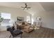 Bright living room with vaulted ceiling, comfy seating, and pool view at 18204 N 11Th Dr, Phoenix, AZ 85023