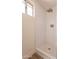 Updated shower with white subway tile and a modern shower head at 18204 N 11Th Dr, Phoenix, AZ 85023