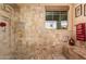 Spa-like bathroom with walk-in shower and bench seating at 18354 W Hatcher Rd, Waddell, AZ 85355