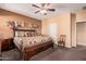 Main bedroom with plush carpet and ensuite bathroom at 18354 W Hatcher Rd, Waddell, AZ 85355