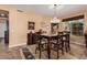 Formal dining room with a stained glass chandelier and wooden table at 18354 W Hatcher Rd, Waddell, AZ 85355