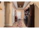 Inviting entryway with a built-in storage bench and wine rack at 18354 W Hatcher Rd, Waddell, AZ 85355