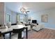 Bright dining area with hardwood floors and modern light fixture at 18416 N Cave Creek Rd # 3044, Phoenix, AZ 85032