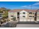 Condo building exterior with attached garages and mountain views at 18416 N Cave Creek Rd # 3044, Phoenix, AZ 85032