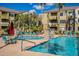 Community pool with seating and umbrellas at 18416 N Cave Creek Rd # 3044, Phoenix, AZ 85032