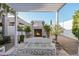 Outdoor patio with fireplace, pergola, and seating area at 19024 W Solano Dr, Litchfield Park, AZ 85340