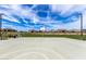 Basketball court with surrounding homes in background at 19024 W Solano Dr, Litchfield Park, AZ 85340