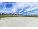 Full-size basketball court in community park setting at 19024 W Solano Dr, Litchfield Park, AZ 85340