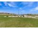 Basketball court and grassy area in a community park at 19024 W Solano Dr, Litchfield Park, AZ 85340