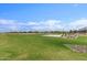 Basketball court and green space in community park at 19024 W Solano Dr, Litchfield Park, AZ 85340