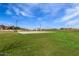 Sand volleyball court and grassy area in a community park at 19024 W Solano Dr, Litchfield Park, AZ 85340