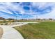 Pathway alongside a basketball court in a community park at 19024 W Solano Dr, Litchfield Park, AZ 85340