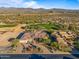 Aerial view of a luxury home on a golf course community at 19115 E Tonto Verde Dr, Rio Verde, AZ 85263