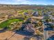 Wide aerial view of the house and surrounding golf course community at 19115 E Tonto Verde Dr, Rio Verde, AZ 85263