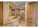 Spa-like bathroom with granite countertop and large mirror at 19115 E Tonto Verde Dr, Rio Verde, AZ 85263