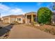 Desert home exterior with driveway and landscaping at 19115 E Tonto Verde Dr, Rio Verde, AZ 85263